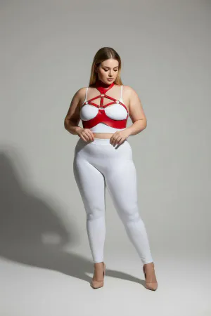 Red faux leather collar and chest harness set worn by a plus-size model.