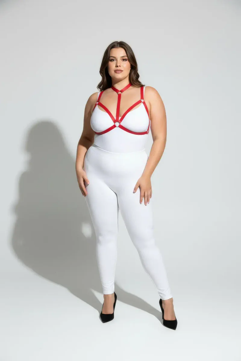 Plus size model wearing red harness with adjustable chest straps and O-ring accents