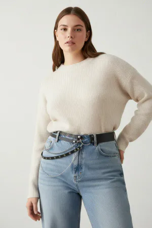 Black Faux Leather Studded O-Ring Belt with Silver Chains over a cream sweater