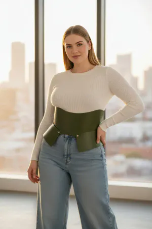 Khaki Faux Leather Corset Belt with Peplum Waist Detail worn by a woman in a fashion alley