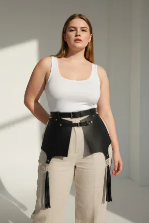 Black Faux Leather Waist Harness with Wide Skirt Panels and Tassels on model