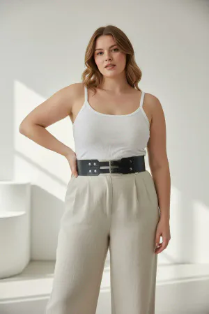 Black Faux Leather Double Buckle Waspie Waist Belt with Silver Studs on a model in a cafe