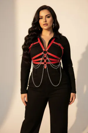 Red Faux Leather Chest Harness with Draping Chains Worn Over Dress